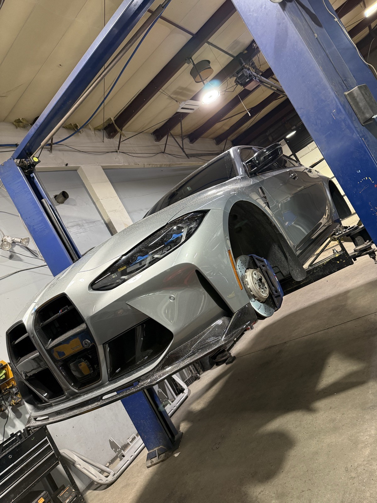 BMW M3 on lift with wheels removed