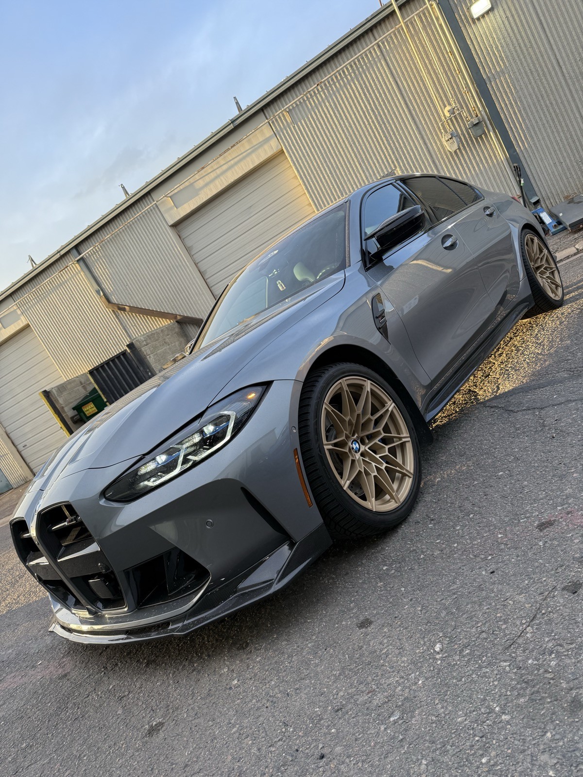 BMW M3 with gold wheels - front angle