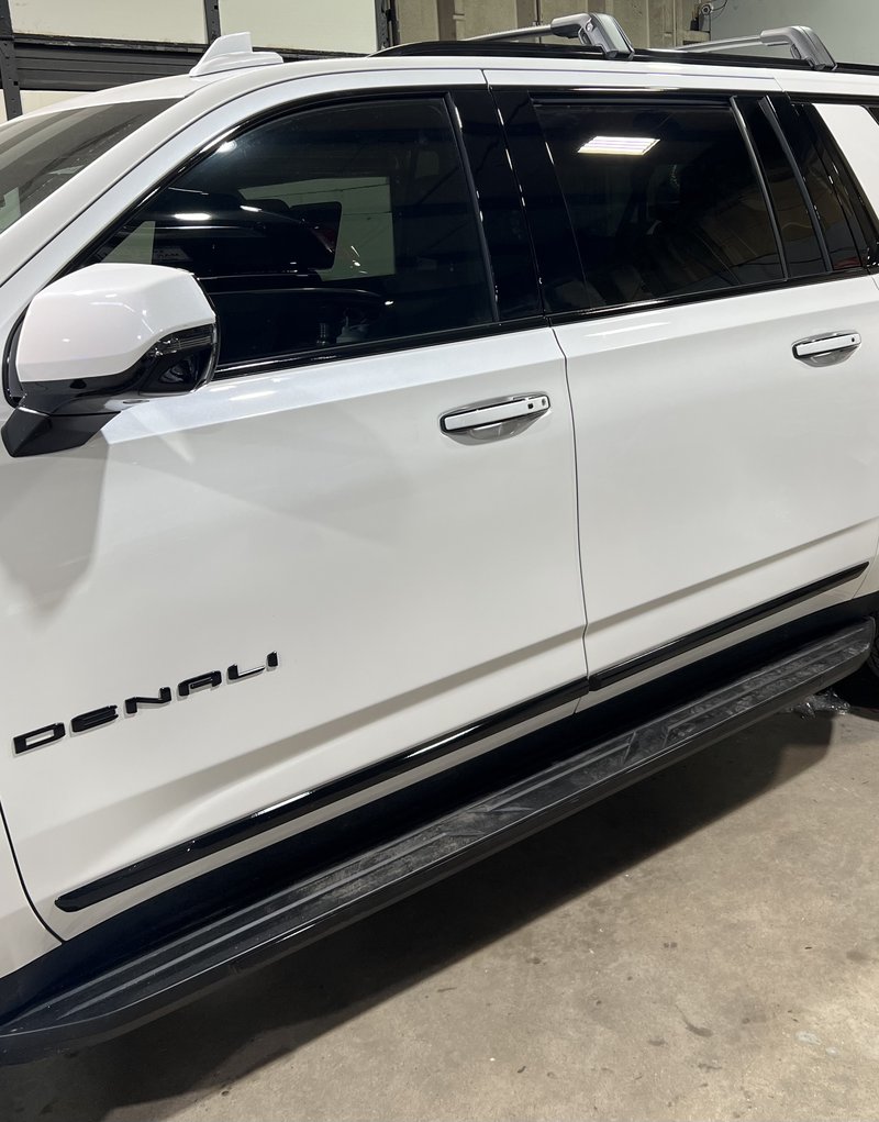 AFTER: White Yukon Denali chrome delete side profile Denver