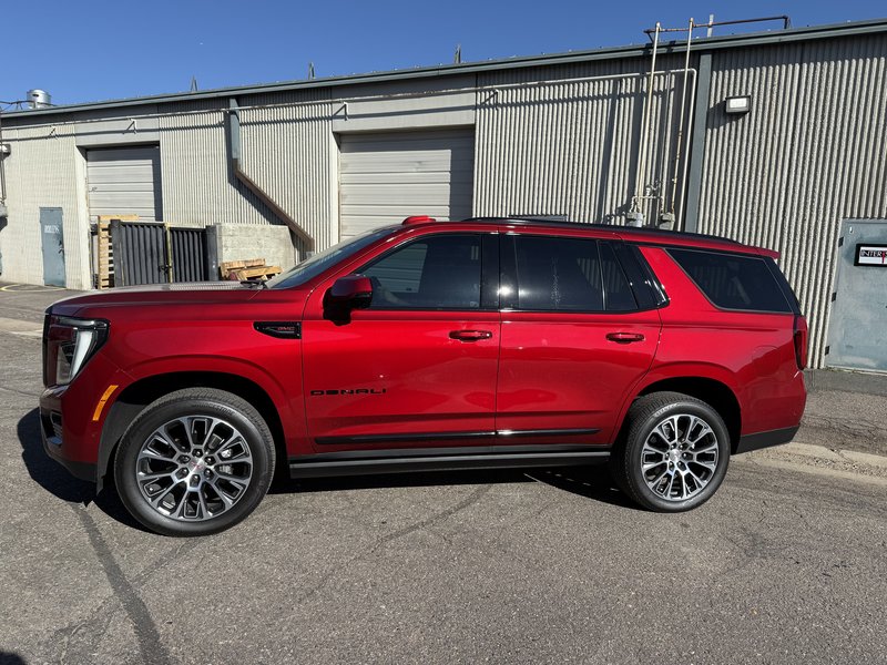 Red GMC Denali full chrome delete side profile Denver