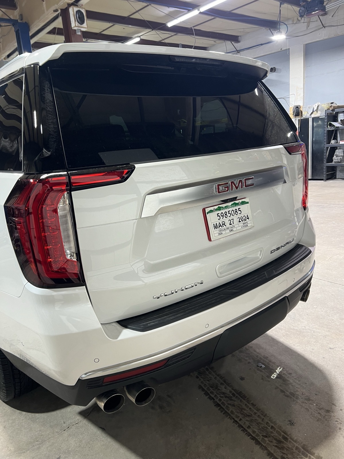 BEFORE: White Yukon Denali chrome rear view Denver