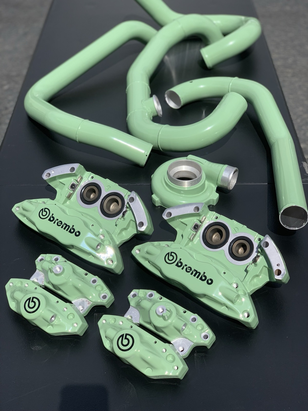 Green Brembo calipers and charge pipes powder coated Denver