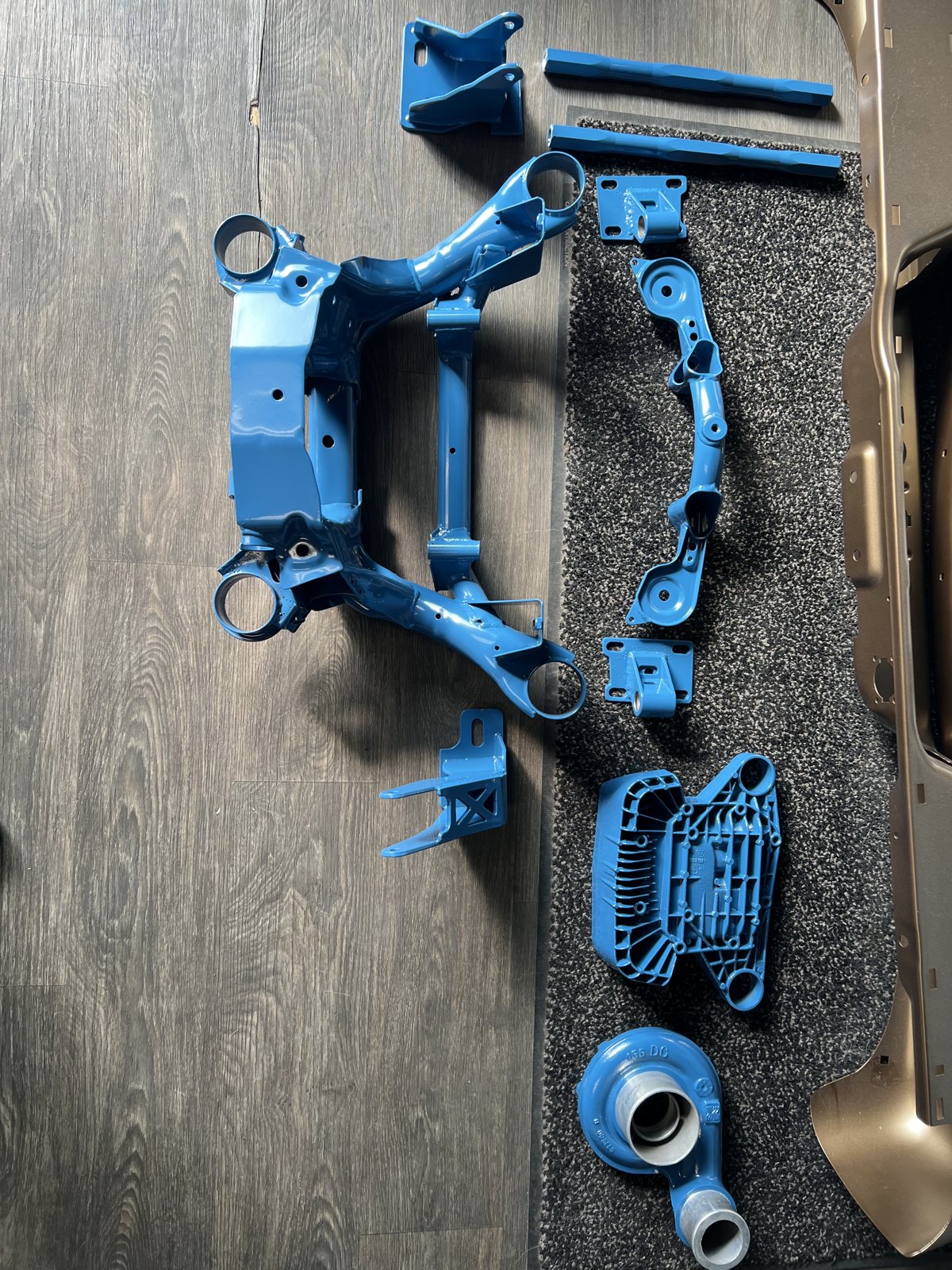 Blue powder coated off-road suspension components Denver